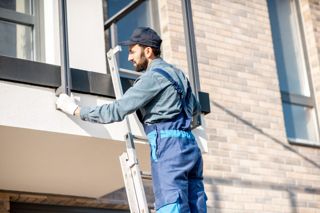 Builder mounting balcony fence